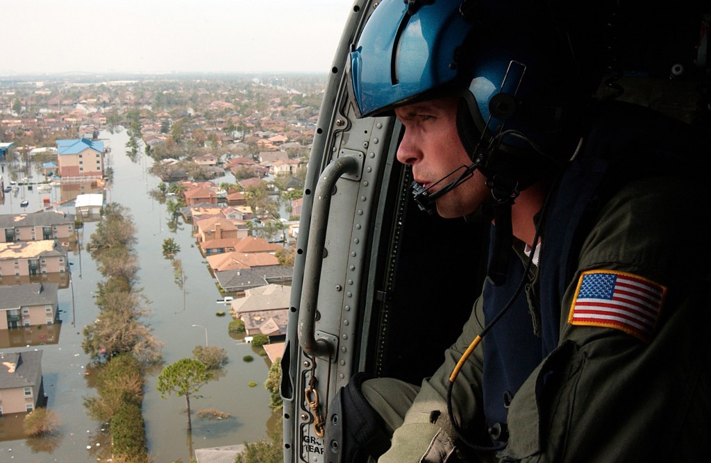 Coast Guard Petty Officer Shawn Beaty looks for survivors in the wake of Hurricane Katrina. Beaty is a member of a helicopter rescue crew sent from Florida to assist in search and rescue efforts. (Photo: PA2 NyxoLyno Cangemi/UPI Photo/Newscom) 