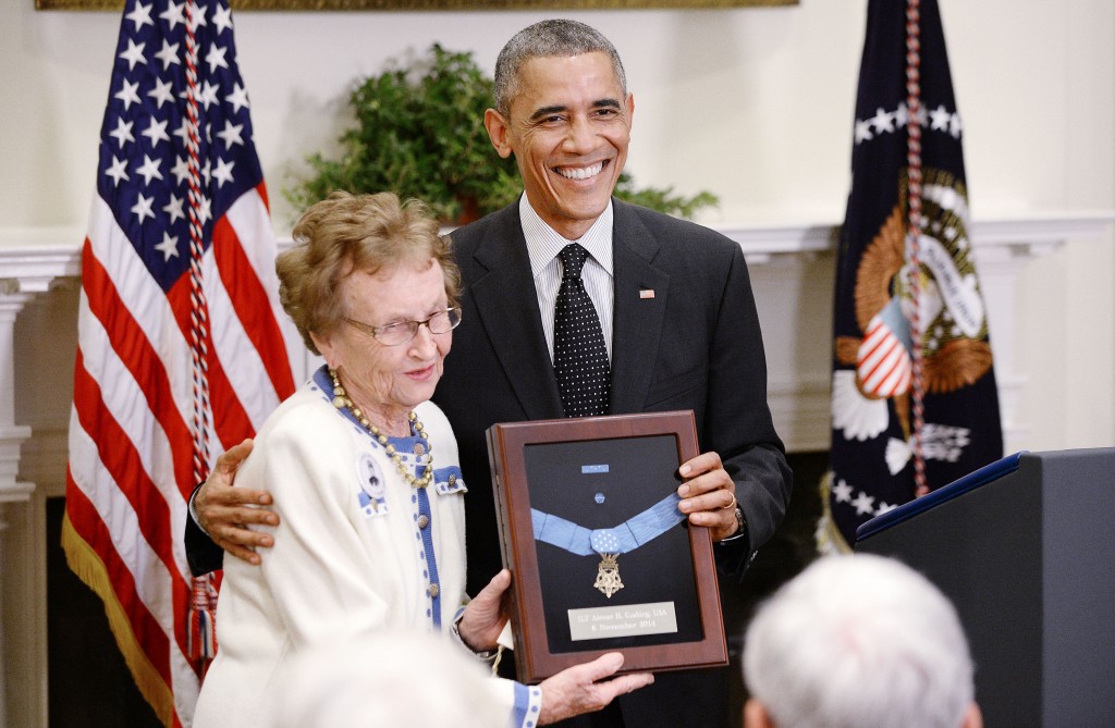 President Barack Obama presents the Medal of Honor posthumously to Army First Lieutenant Alonzo H. Cushing for conspicuous gallantry to Helen Loring Ensign in the Roosevelt Room of the White House. (Photo: Olivier Douliery/Newscom)