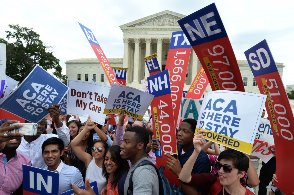 Supporters of the Affordable Care Act celebrate a 6-3 Supreme Court ruling upholding all provisions of the health care law on June 25, 2015. (Photo: Pat Benic/UPI/Newscom)