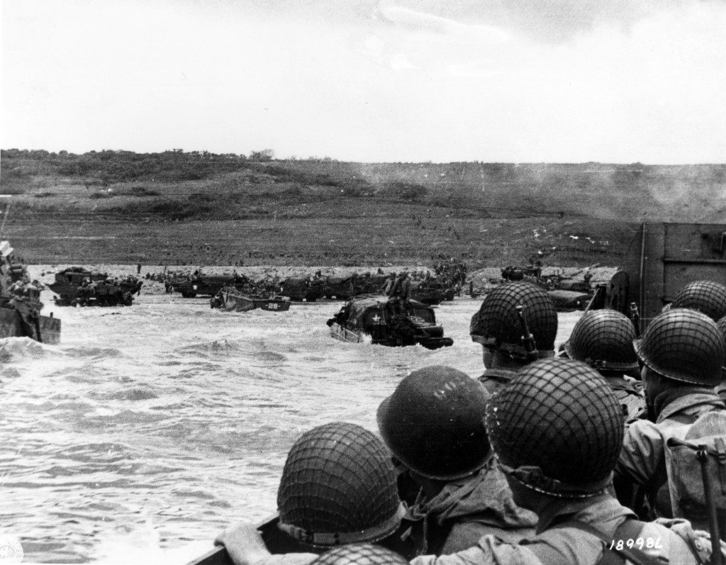 Troops watch activity ashore on Omaha Beach as their LCVP landing craft approaches the shore on D-Day, June 6, 1944, during the Allied invasion of German-occupied France. (Photo: U.S. Army Signal Corps/National Archives/UPI/Newscom)