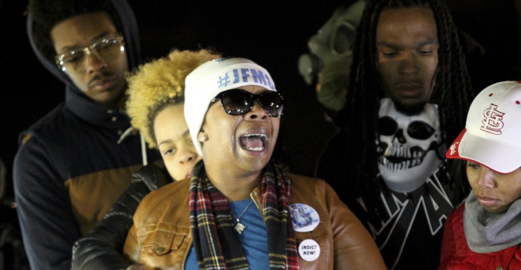 Michael Brown's mother, cries after learning of a grand jury's decision to not indict police officer Darren Wilson. (Photo: Timothy Tai/Newscom)