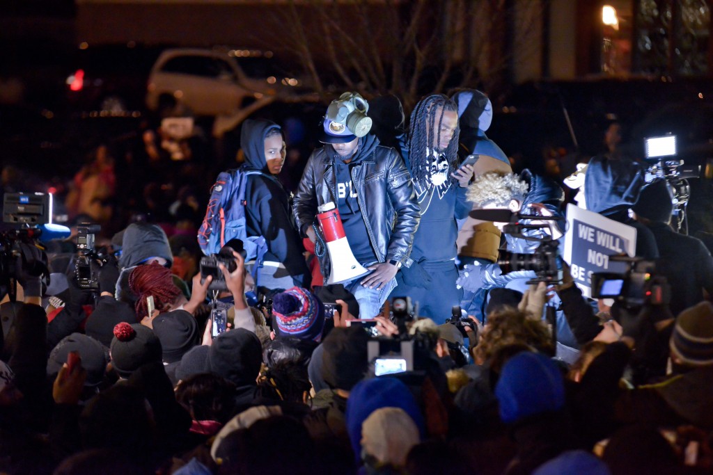 A group of protesters lead the gathering before the Ferguson police department. (Photo: Richard Ulreich/Newscom)