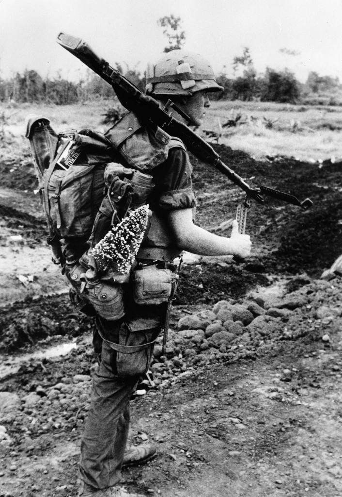 Marine Frank Bunton s prepared for Christmas as he carries a tree while on a search and destroy mission near the Demilitariezed Zone north of Con Thien, Vietnam. (Photo:  Keystone Pictures/Newscom)