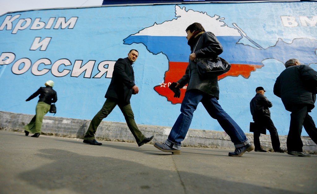A mural showing the Crimean peninsula in Russian national colours on the wall of a building in Moscow's Taganskaya Square. The message reads 'Crimea and Russia are united forever!' (Photo: Zurab Dzhavakhadze/ITAR-TASS/ZUMAPRESS.com)