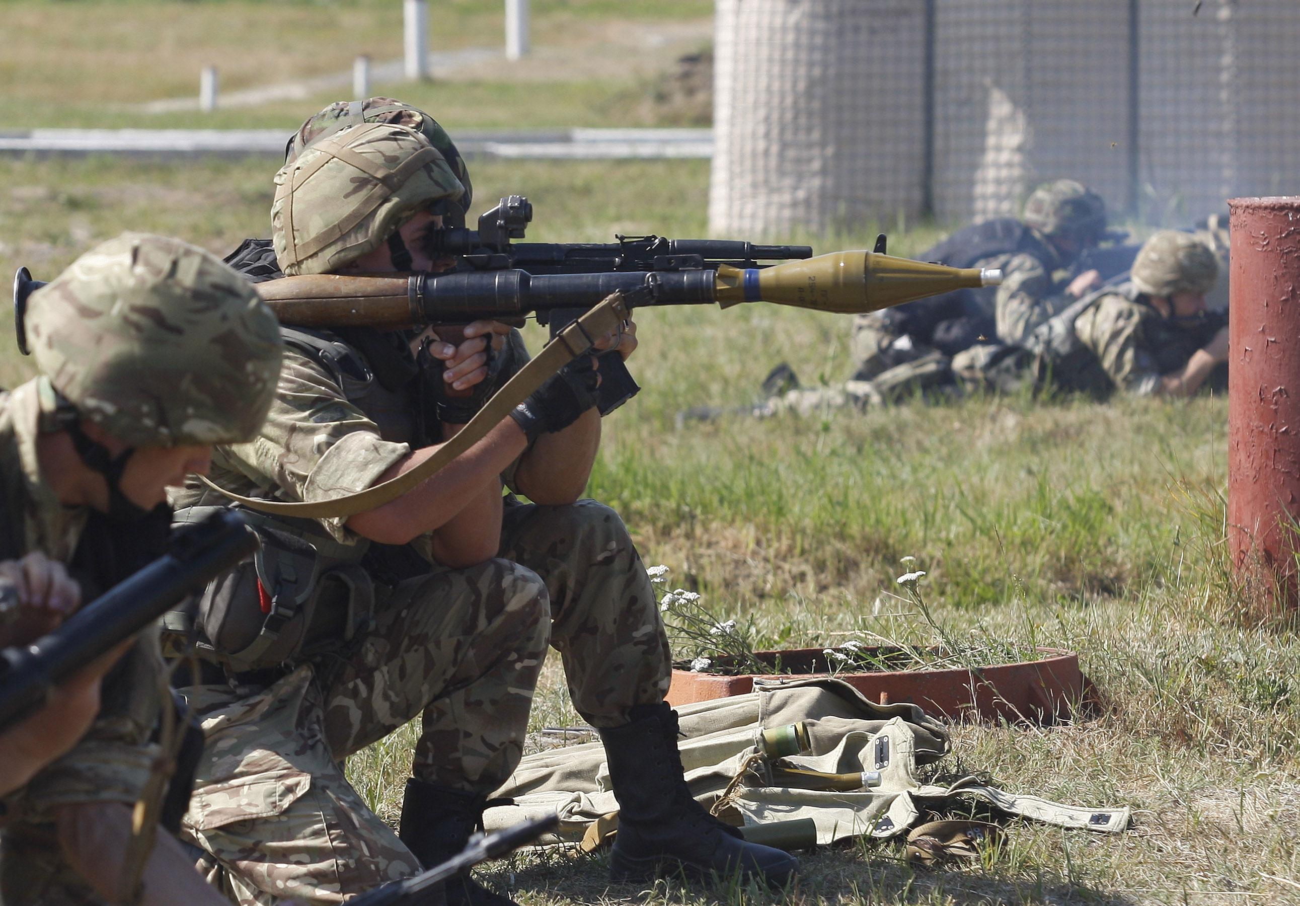 Soldiers of the Ukrainian National Guard train on the shooting range in the village of Novi Petrivtsi, Ukraine, July 22, 2015. (Photo: Str/Zuma Press/Newscom)