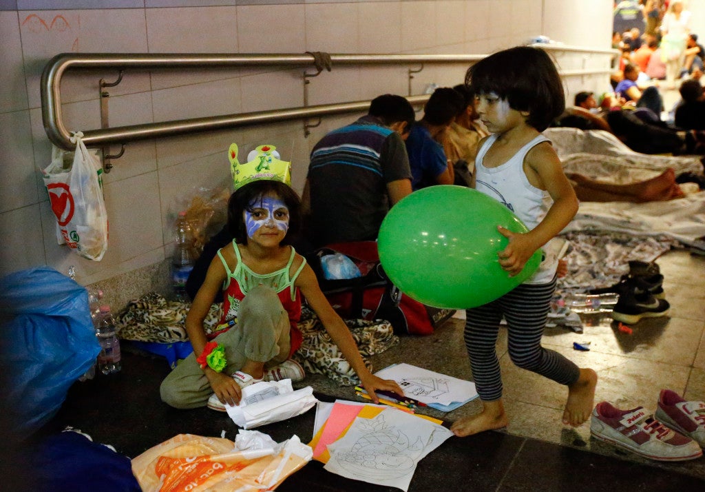 Children play at a makeshift camp in an underground station near the Keleti train station. (Photo: Reuters/Leonhard Foeger/Newscom)