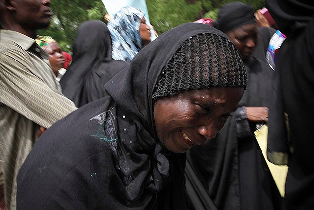 Parents and relatives of kidnapped schoolgirls react during a protest over the Nigerian government's failure to rescue the abducted girls. (Photo: EPA/STR/Newscom)