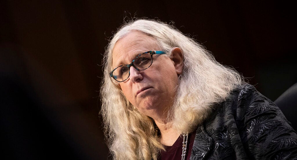 Blond man with long hair and glasses