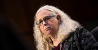 Blond man with long hair and glasses