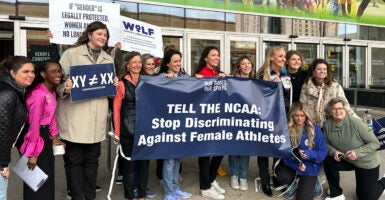 women protest NCAA rule allowing males to compete in women's sports