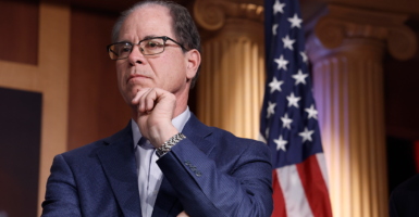 Sen. Mike Braun in front of an American flag