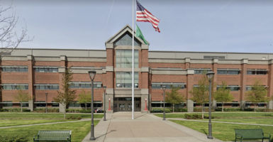 Auburn High School in Auburn, Washington, with an American flag out front