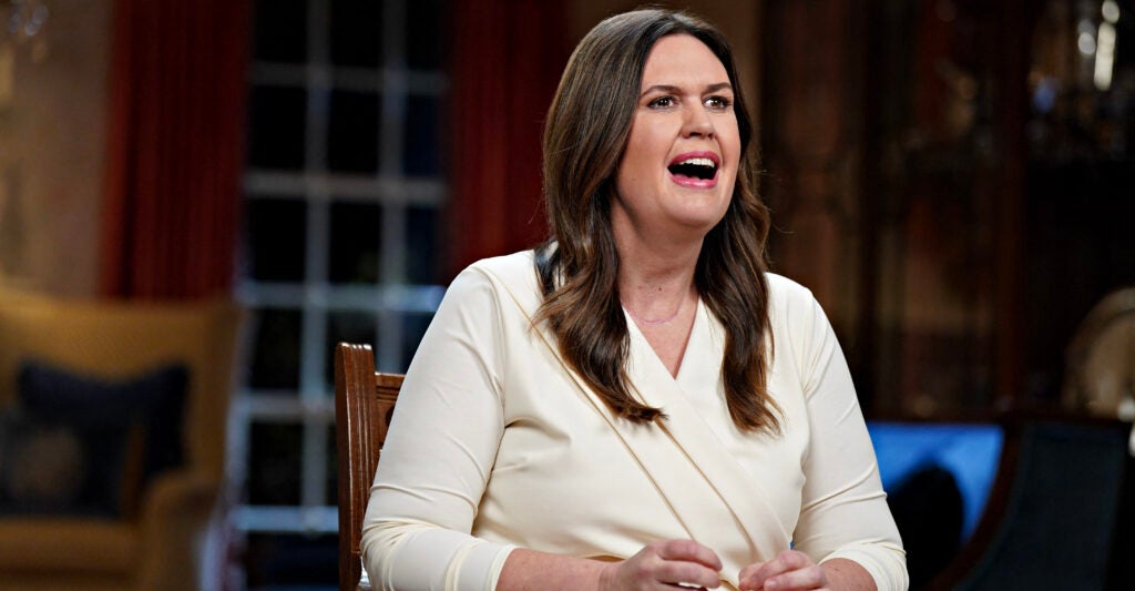 Sarah Huckabee Sanders in a white suit