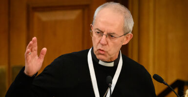 Justin Welby in a black priest's robe with a white collar