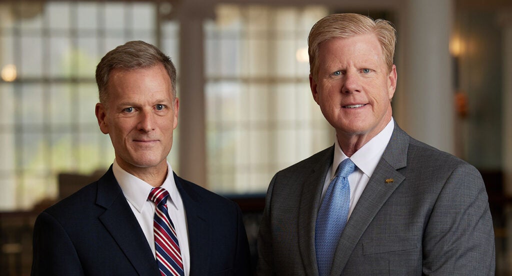 Dondi Costin and Jonathan Falwell in suits