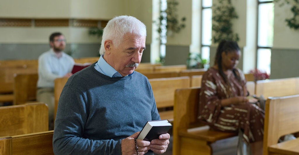 Man praying in church