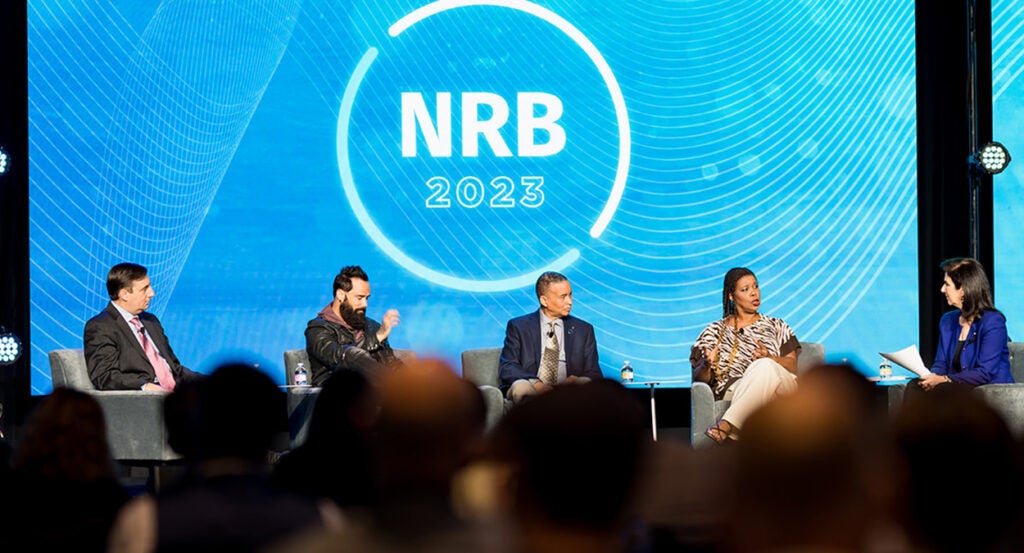 National Religious Broadcasters Logo in blue behind five people dressed in suits