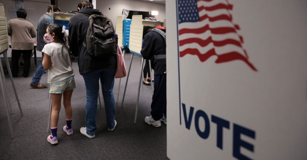 people at a voting booth