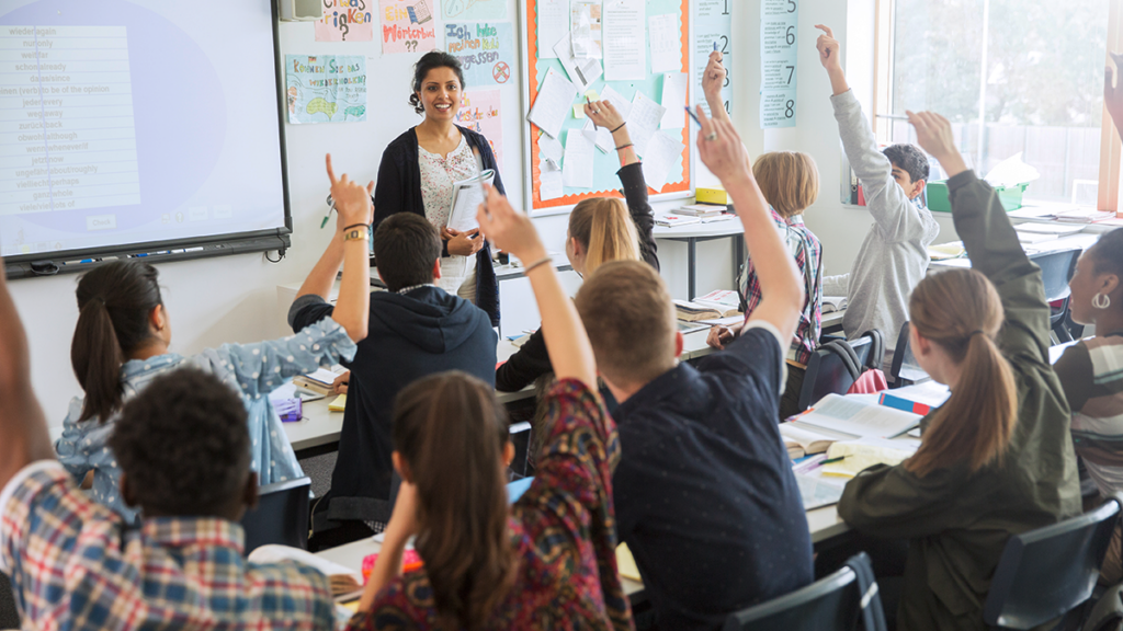 Teacher and students in a high school classroom