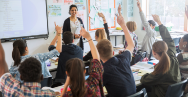 Teacher and students in a high school classroom