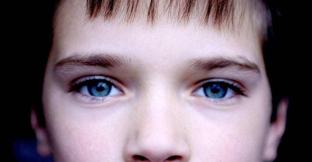 young boy looking into the camera