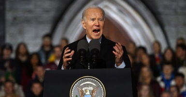 Joe Biden shouts angrily in front of a church