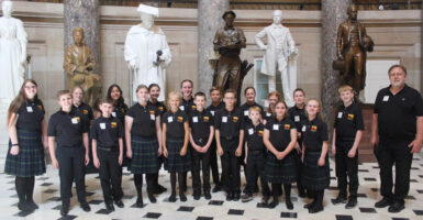 The Rushingbrook Children's Choir in suits and dresses in Statuary Hall