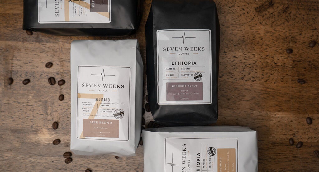 Coffee bean bags with the Seven Weeks Coffee brand