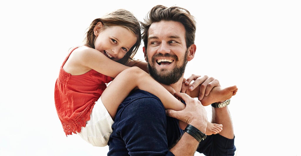 daughter on father's shoulders