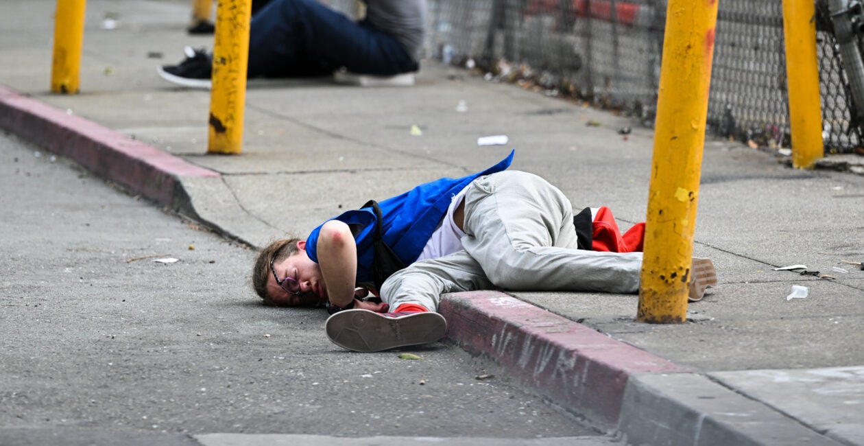 Man passed out on street.