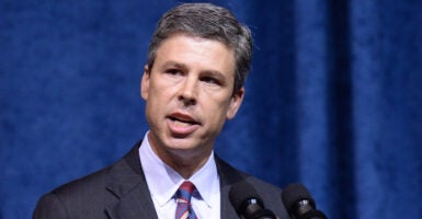 Chattanooga Mayor Andy Berke speaks in a pin-stripe grey suit