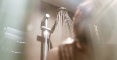 A person in a locker room shower