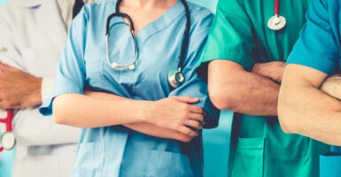 Doctors in scrubs with a stethoscope