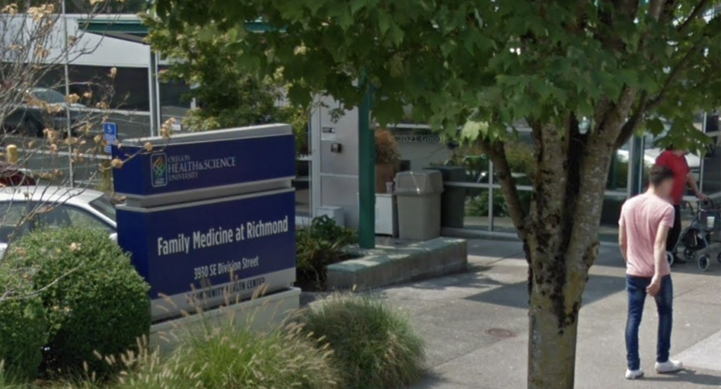 Clinic building with a blue sign out front reading "Family Medicine at Richmond"