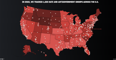 A red and black map of the United States with dots for 