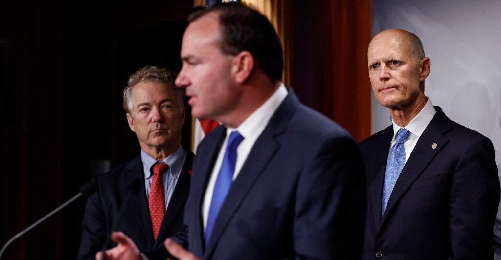 Mike Lee, Rand Paul, and Rick Scott in suits