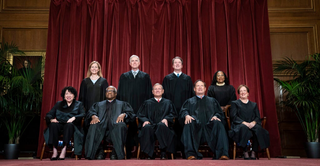 Washington, DC - October 7 : Members of the Supreme Court sit for a group photo following the recent addition of Associate Justice Ketanji Brown Jackson, at the Supreme Court building on Capitol Hill on Friday, Oct 07, 2022 in Washington, DC. Bottom row, from left, Associate Justice Sonia Sotomayor, Associate Justice Clarence Thomas, Chief Justice of the United States John Roberts, Associate Justice Samuel Alito, and Associate Justice Elena Kagan. Top row, from left, Associate Justice Amy Coney Barrett, Associate Justice Neil Gorsuch, Associate Justice Brett Kavanaugh, and Associate Justice Ketanji Brown Jackson. (Photo by Jabin Botsford/The Washington Post via Getty Images)