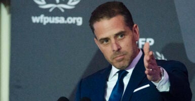 Hunter Biden gestures at a podium