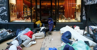 Illegal aliens sleep outside the Roosevelt Hotel in New York City.