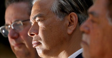 California Attorney General Rob Bonta looks to the left