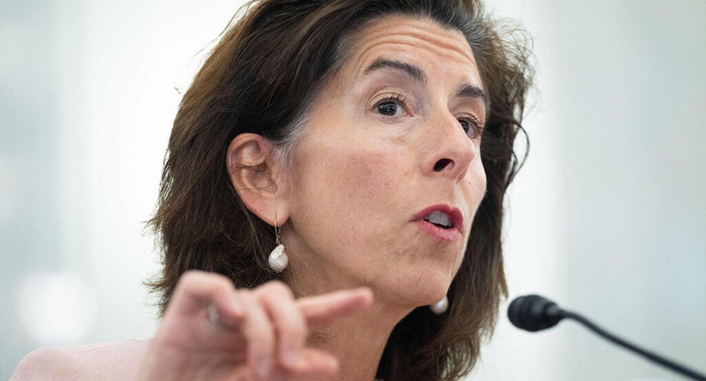 Gina Raimondo wearing earrings speaks during testimony