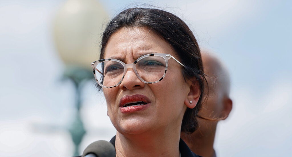 Rashida Tlaib grimaces in round glasses