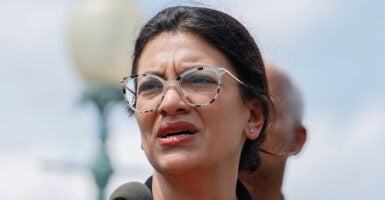 Rashida Tlaib grimaces in round glasses