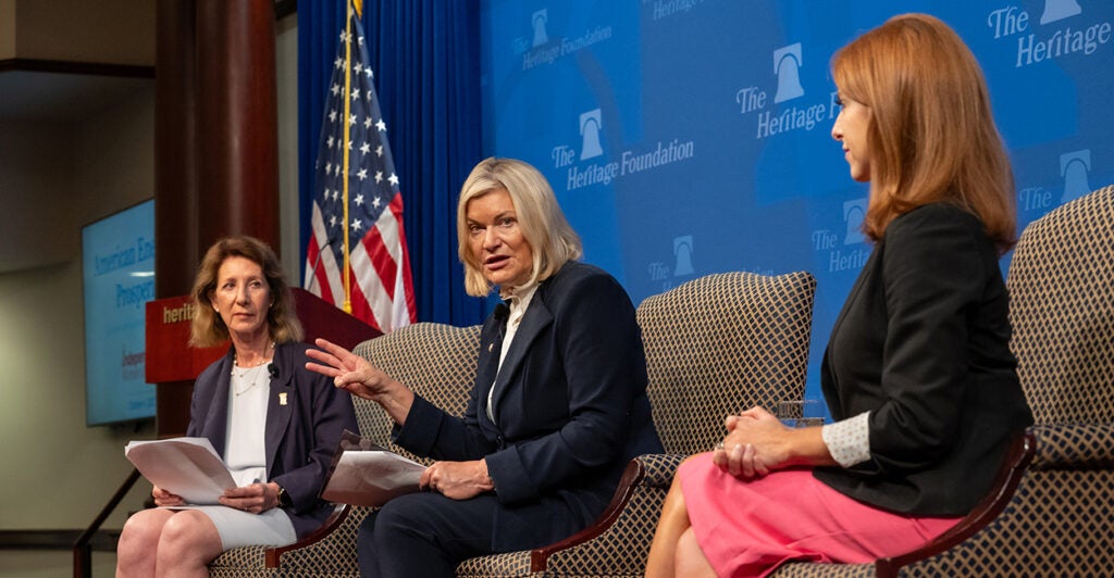 Diana Furchtgott-Roth, Cynthia Lummis, and Mandy Gunasekara sit together on stage at the Heritage Foundation