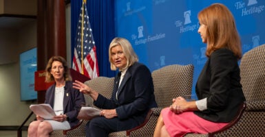 Diana Furchtgott-Roth, Cynthia Lummis, and Mandy Gunasekara sit together on stage at the Heritage Foundation