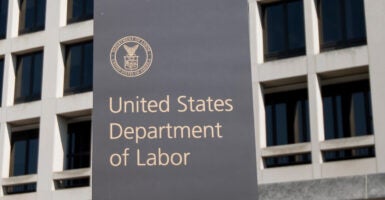 U.S. Labor Dept. headquarters building with Labor Dept. sign in front.