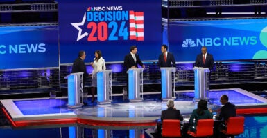 Republican presidential candidates former New Jersey Gov. Chris Christie, former U.N. Ambassador Nikki Haley, Florida Gov. Ron DeSantis, Vivek Ramaswamy, and Sen. Tim Scott talk during a break on stage at the third GOP debate.