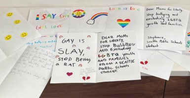 LGBTQ-themed letters reading "gay is slay"