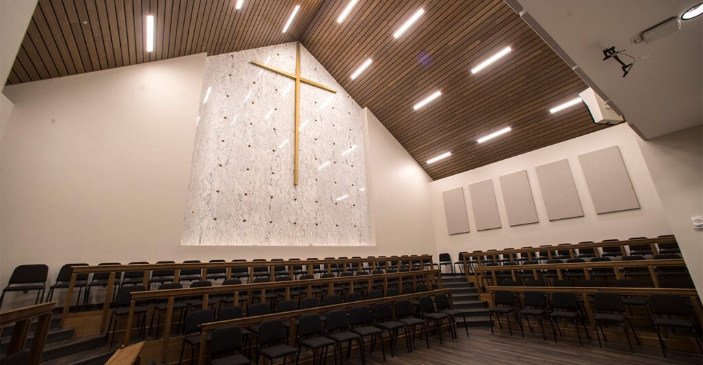 Inside of a church with a large cross