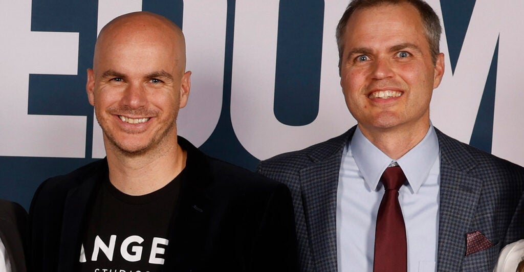 Brothers Jeff and Neal Harmon stand together and smile for the camera at the "Sound of Freedom" premier.